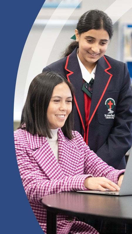 Teacher with her students in the classroom at St John Paul II Catholic College Schofields