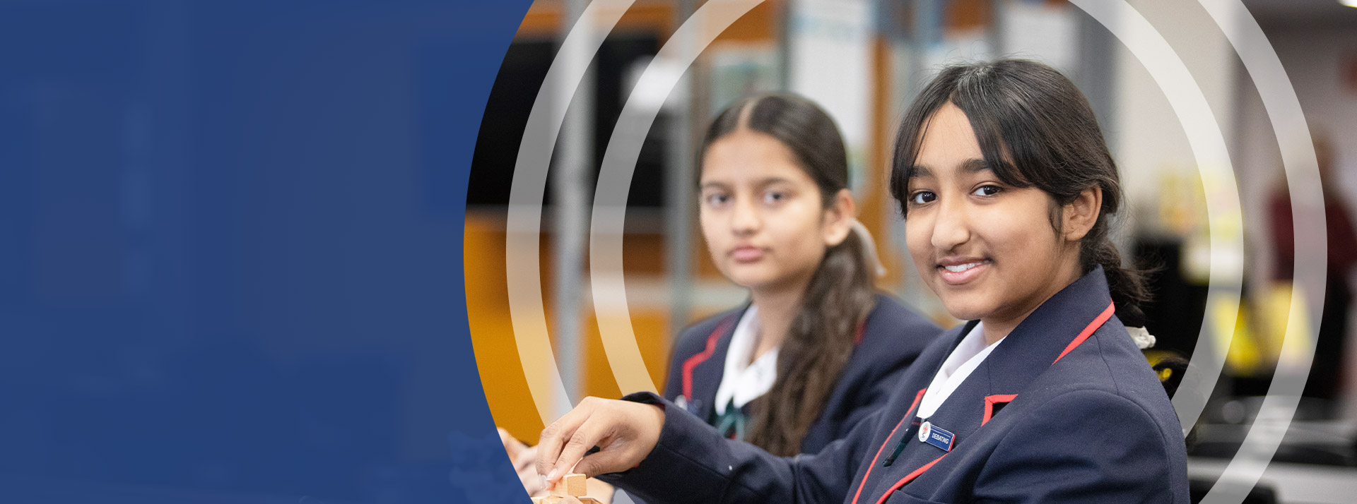 Students smiling in the classroom at St John Paul II Catholic College Schofields