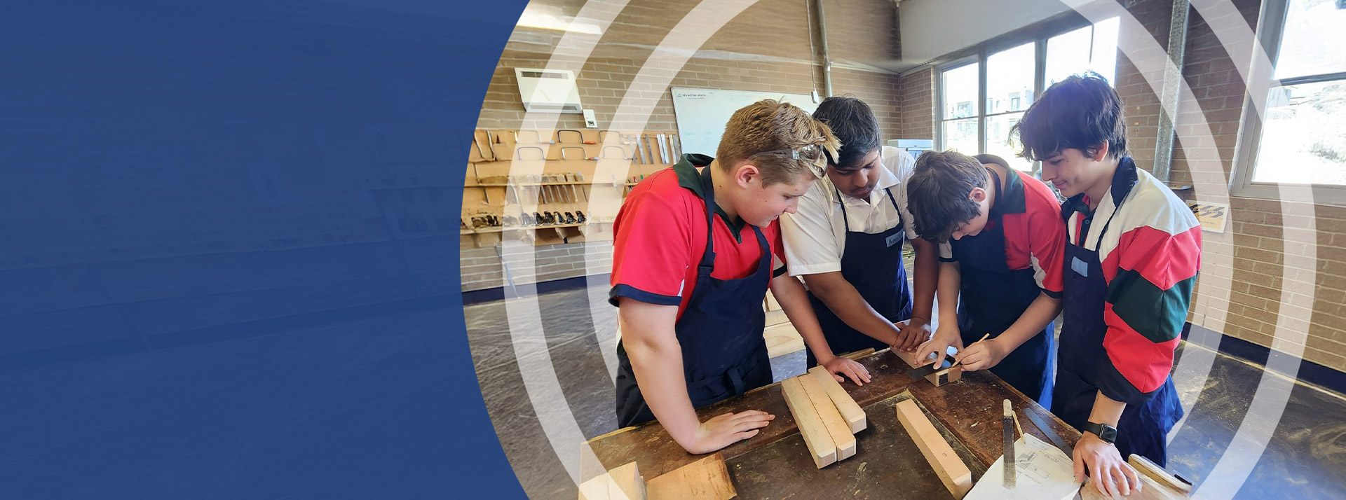 Students working together in the wood work room at St John Paul II Catholic College Schofields