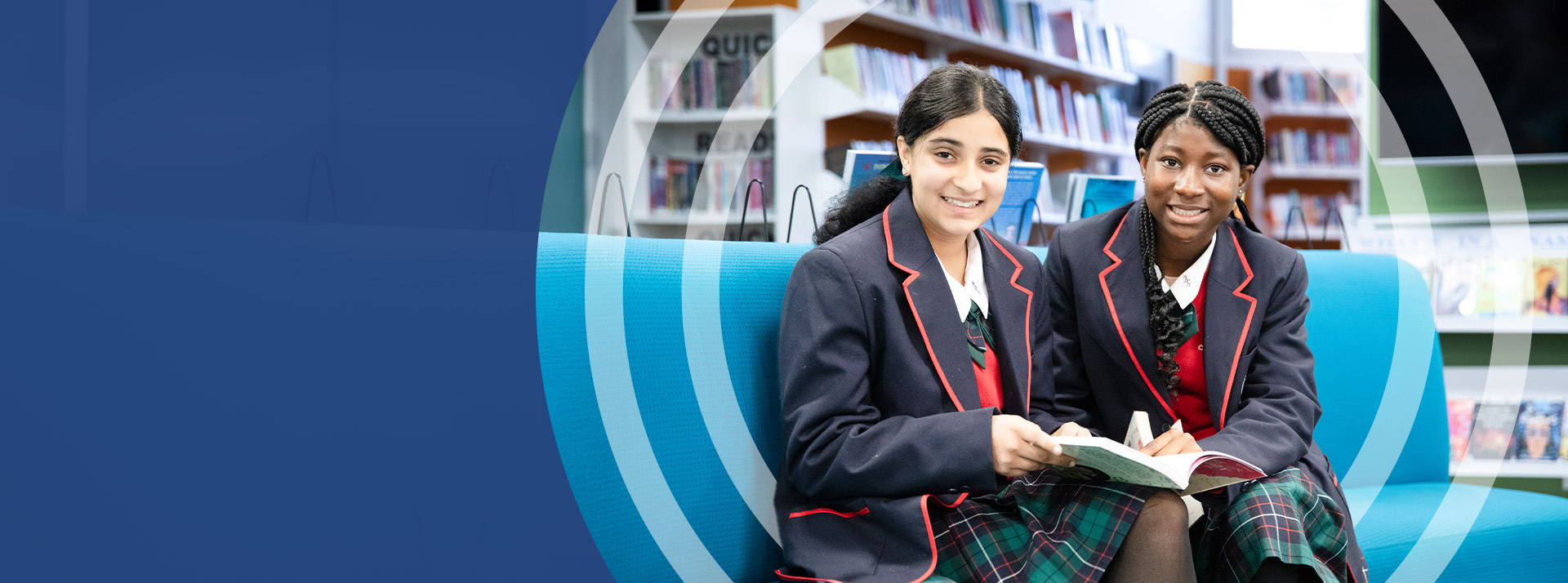 Students reading together in the library at St John Paul II Catholic College Schofields