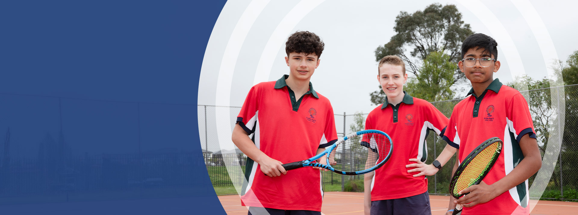 Students holding their tennis racket outside at St John Paul II Catholic College Schofields 