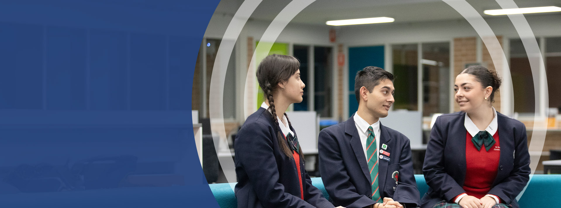 Students speaking to each other in the library at St John Paul II Catholic College Schofields