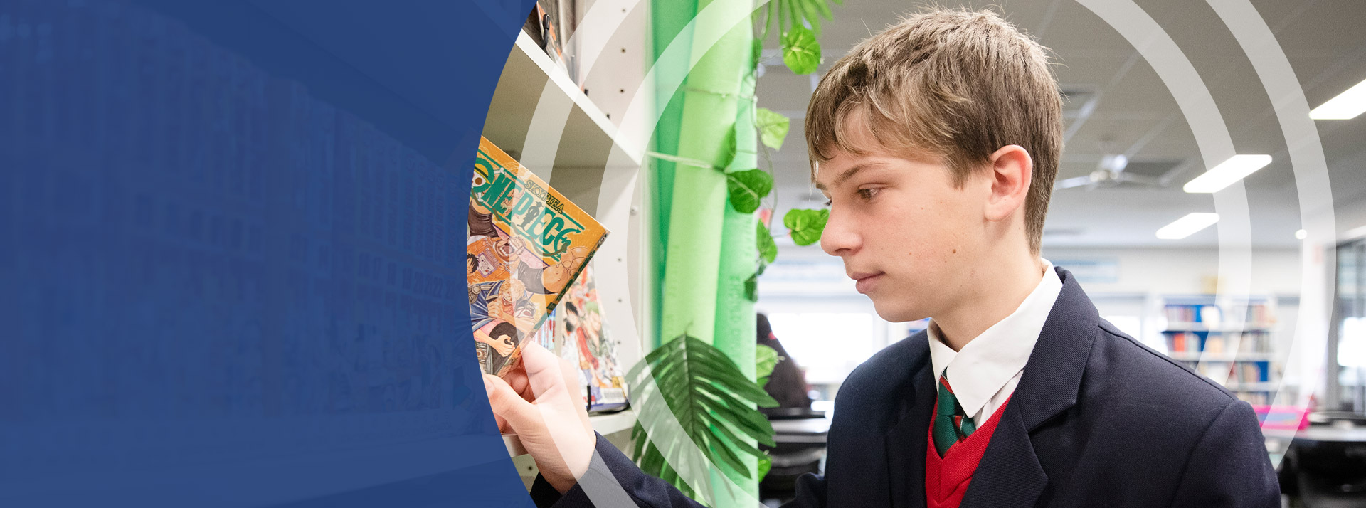 Student selecting a book from the library at St John Paul II Catholic College Schofields