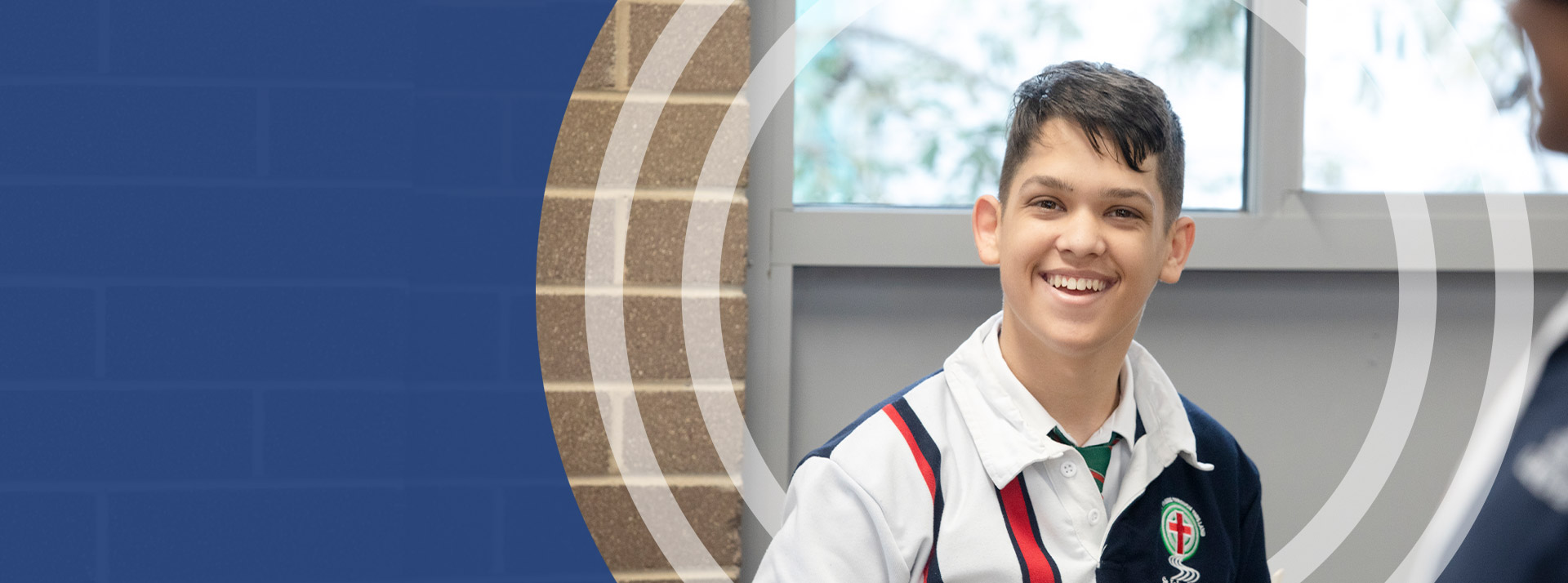Student smiling in the classroom at St John Paul II Catholic College Schofields
