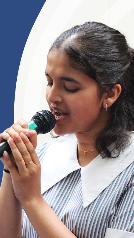 Student singing in the school band at St John Paul II Catholic College Schofields and Nirimba