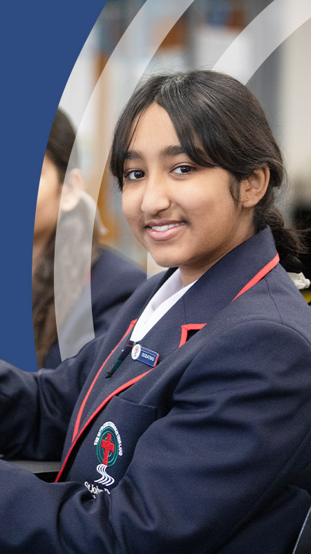 Students smiling in the classroom at St John Paul II Catholic College Schofields