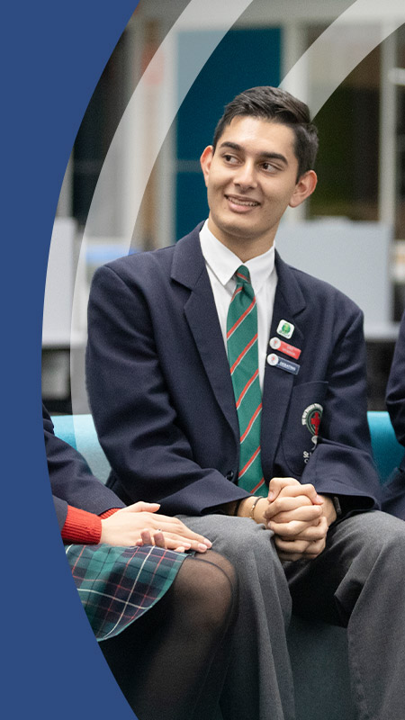 Students sitting together in the library at St John Paul II Catholic College Schofields