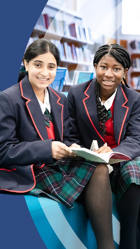 Students reading together in the library at St John Paul II Catholic College Schofields