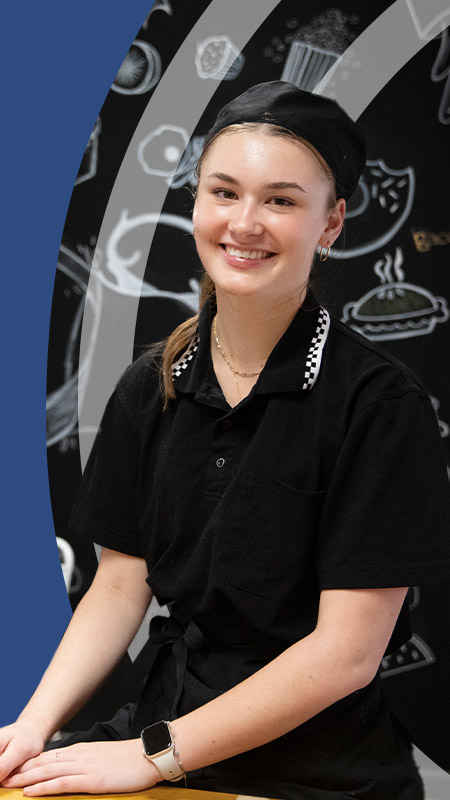 Students smiling in the school cafe at St John Paul II Catholic College Schofields