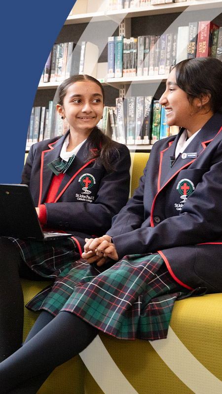 Students sitting together in the library at St John Paul II Catholic College Schofields