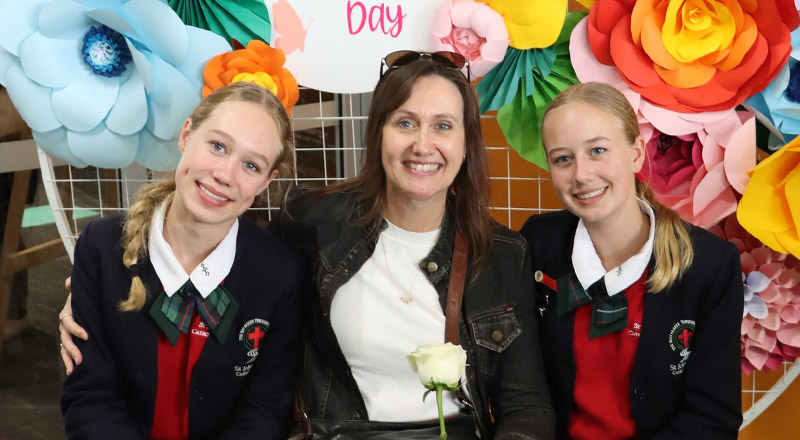 Mother with her daughters at a Mothers Day event at St John Paul II Catholic College Schofields