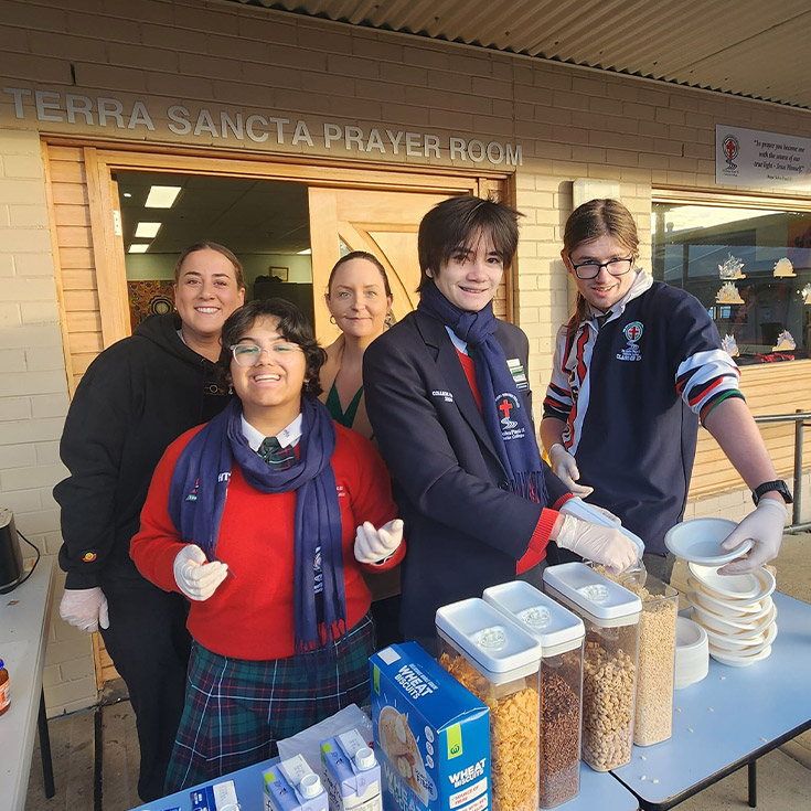 Students serving their peers breakfast during breakfast club at St John Paul II Catholic College Schofields and Nirimba