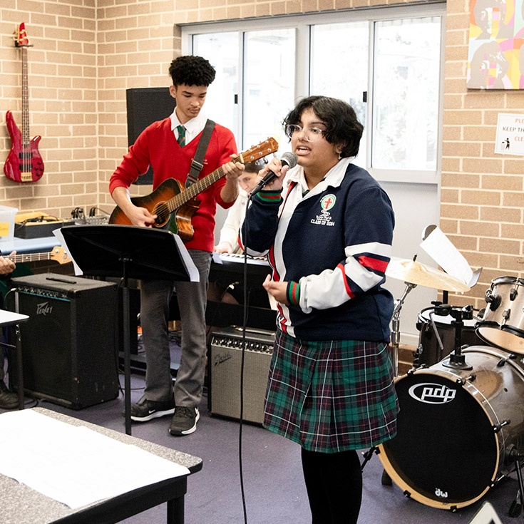 Students practising music in the music room at St John Paul II Catholic College Schofields